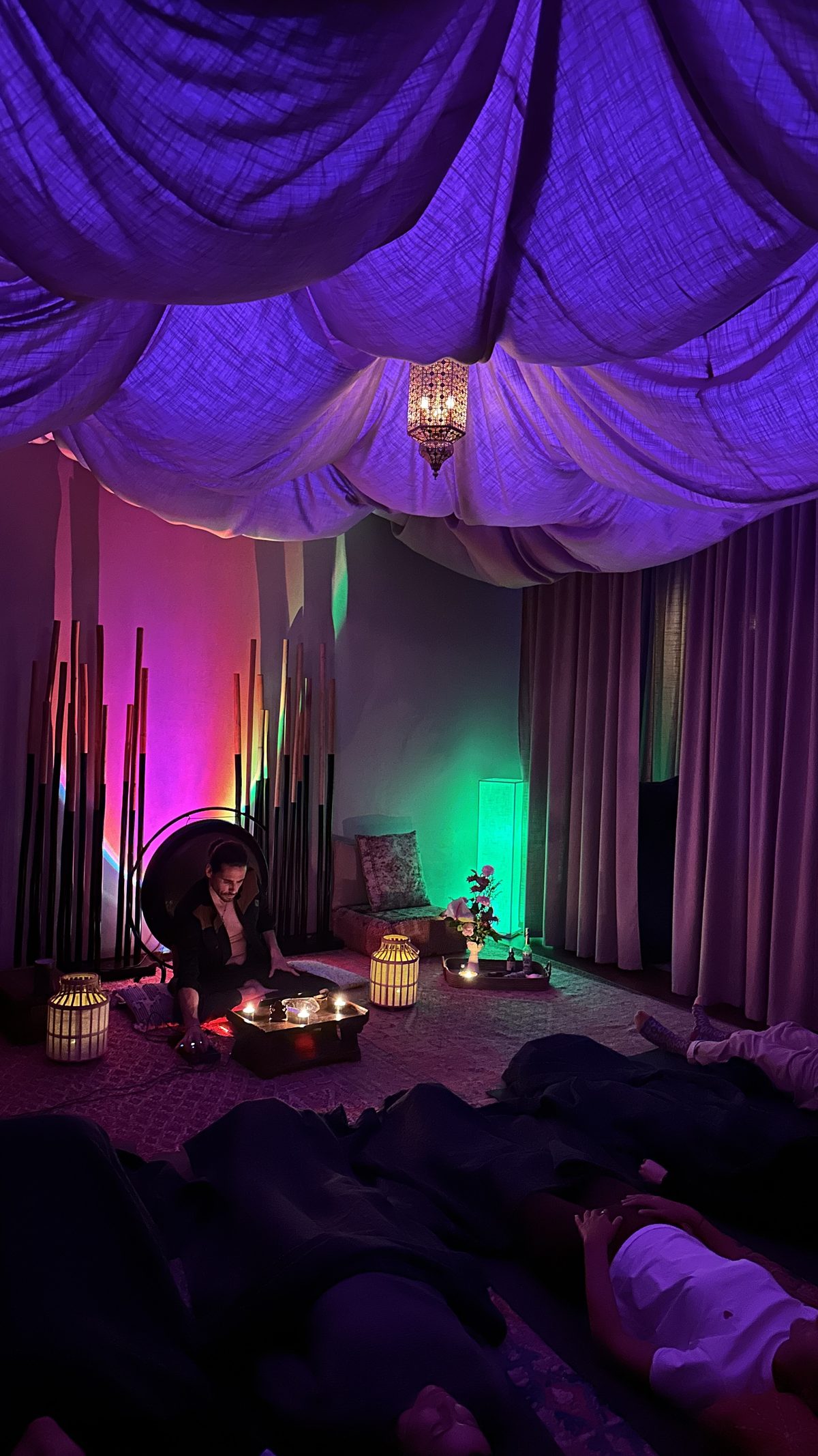 An Alchemy Rewire session under draped cloth and coloured light