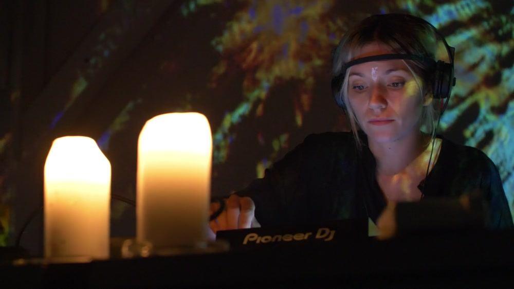 A performer wearing a sensor headband at TRANS-LATE