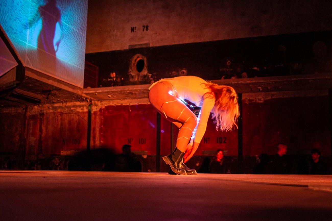 A dancer painting the room with movement