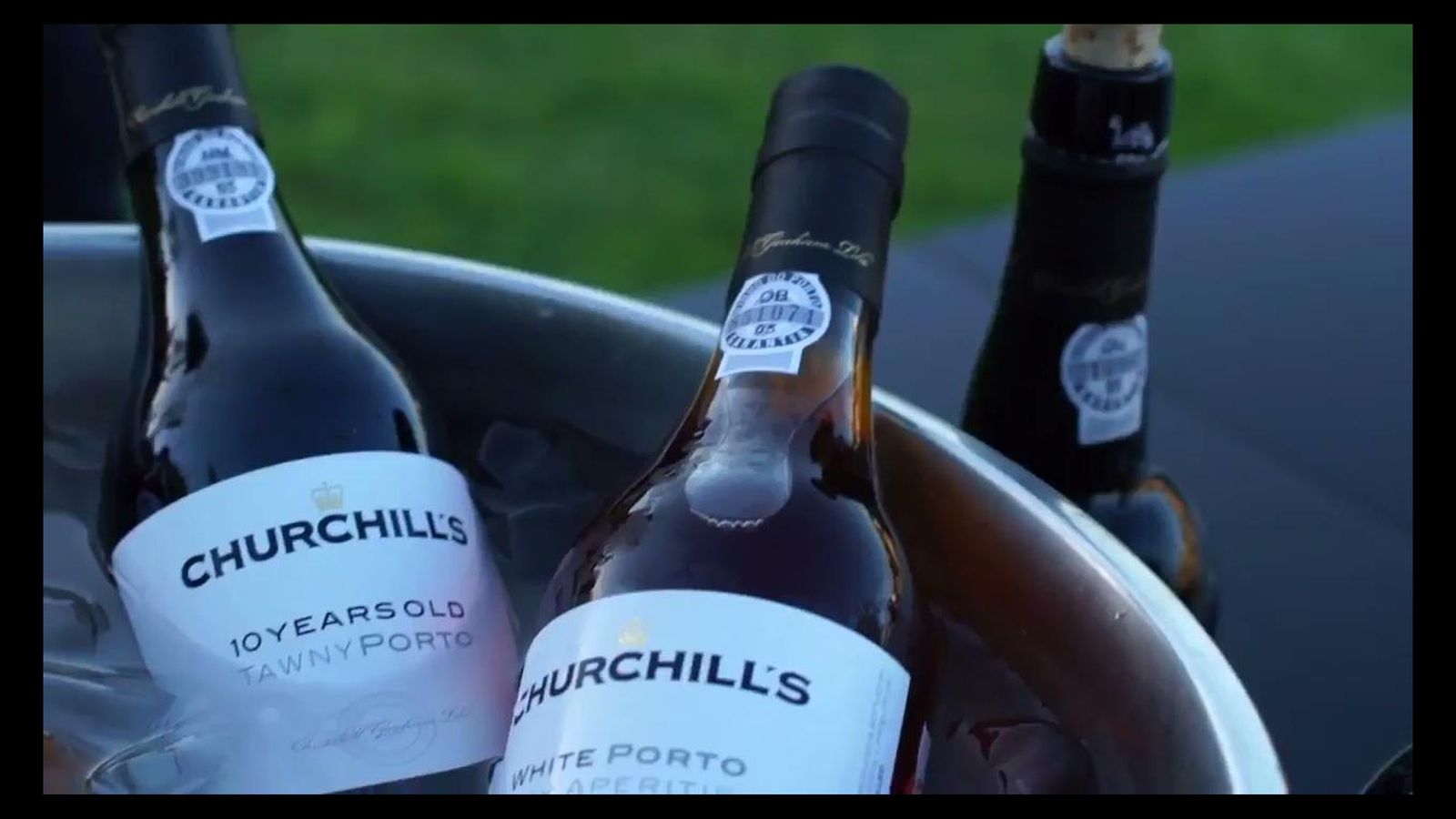 Bottles of Port wine in an ice bucket at a tasting